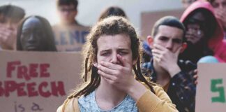 Protester covering mouth during rally