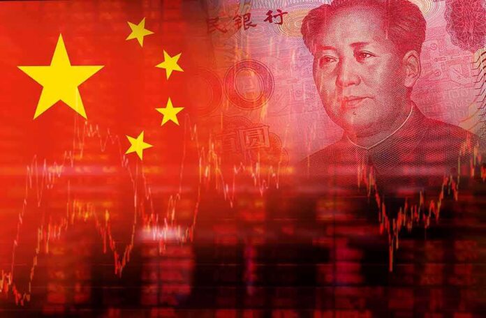 shutterstock_309066704-1 Chinese flag overlaid with yuan banknote and stock market graph