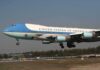 Airplane with blue and white livery landing approach