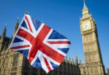 Rebels Corner Westminster – Shock Pact Dares The Crown Union Jack flag with Elizabeth Tower in the background