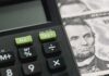 Calculator with tax buttons beside U.S. currency