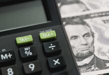 Calculator with tax buttons beside U.S. currency