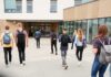 Confucius Institutes – Hidden Beijing Pipeline Exposed Students with backpacks walking toward a school entrance