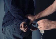 Explosives Stash Alarm – Assassination Plot Rocks Poland’s Top Brass person being handcuffed behind the back