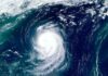 Okinawa Braces: Flights Axed, Seas Rage Satellite view of a powerful hurricane swirling over the ocean