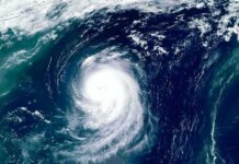 Okinawa Braces: Flights Axed, Seas Rage Satellite view of a powerful hurricane swirling over the ocean