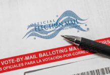 California Pushback Meets Federal Heat – Judge Orders Deep Dive On Ballots Official election mail envelope with pen