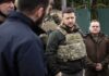 Zelensky Hints Bigger Lyman Breakthrough man in tactical vest standing with group outdoors
